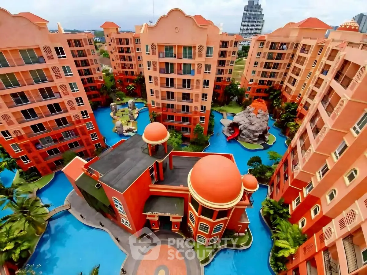 Stunning aerial view of vibrant residential complex with unique architecture and lush landscaping.