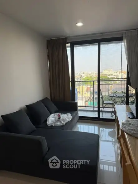 Cozy living room with balcony view and modern furniture