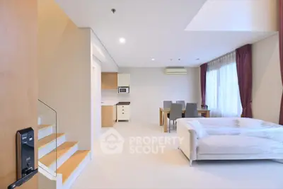 Spacious modern living room with dining area and natural light