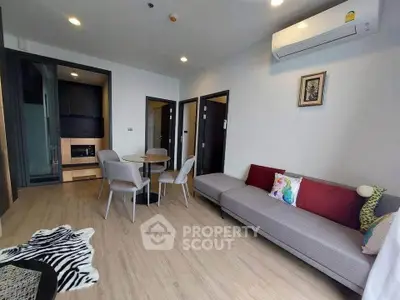 Modern living room with stylish furniture and air conditioning in a cozy apartment.