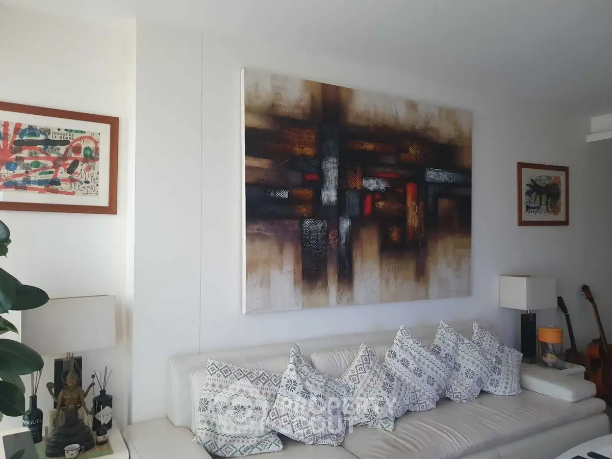 Stylish living room with abstract art and cozy seating area