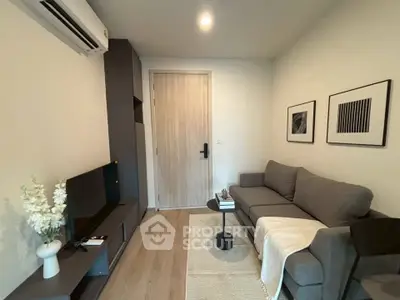 Modern living room with sleek furniture and stylish decor in a cozy apartment.