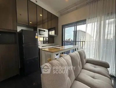 Modern apartment living room with open kitchen and balcony view