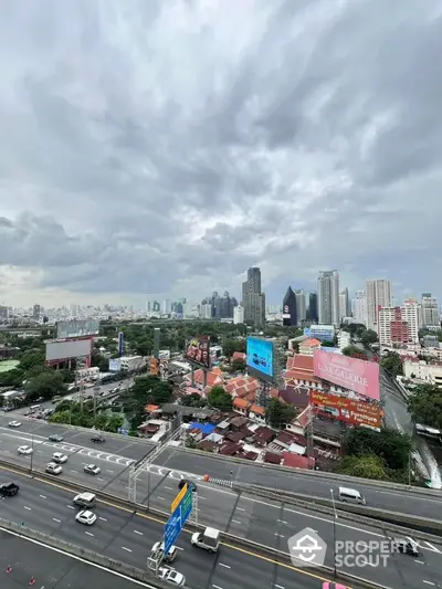 Stunning cityscape view with skyscrapers and highway, perfect urban living.