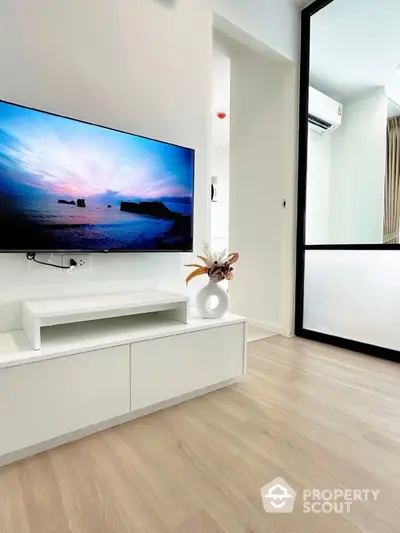 Modern living room with sleek TV setup and elegant decor