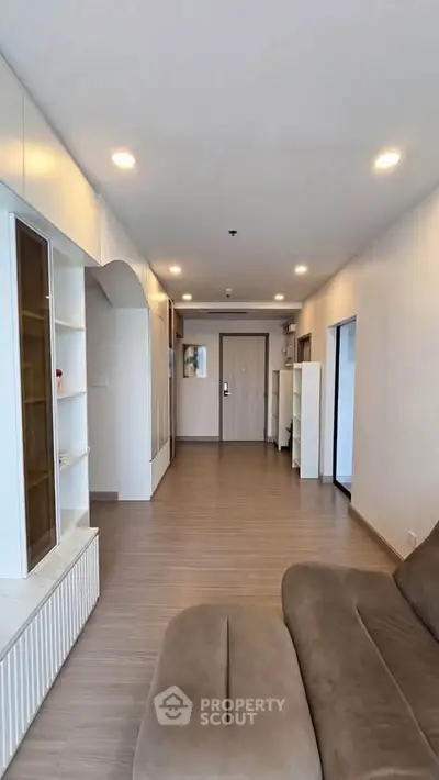 Spacious modern living room with sleek design and ample natural light, perfect for relaxation and entertainment.