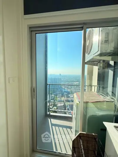 Modern apartment balcony with stunning city view and air conditioning unit.