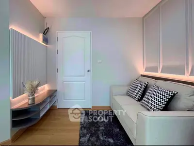 Modern living room with stylish sofa and decorative wall panels