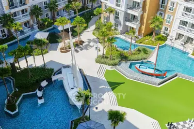Luxurious apartment complex with stunning pool and unique boat features.