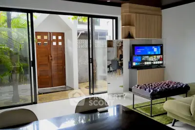 Modern living room with sliding glass doors and stylish decor