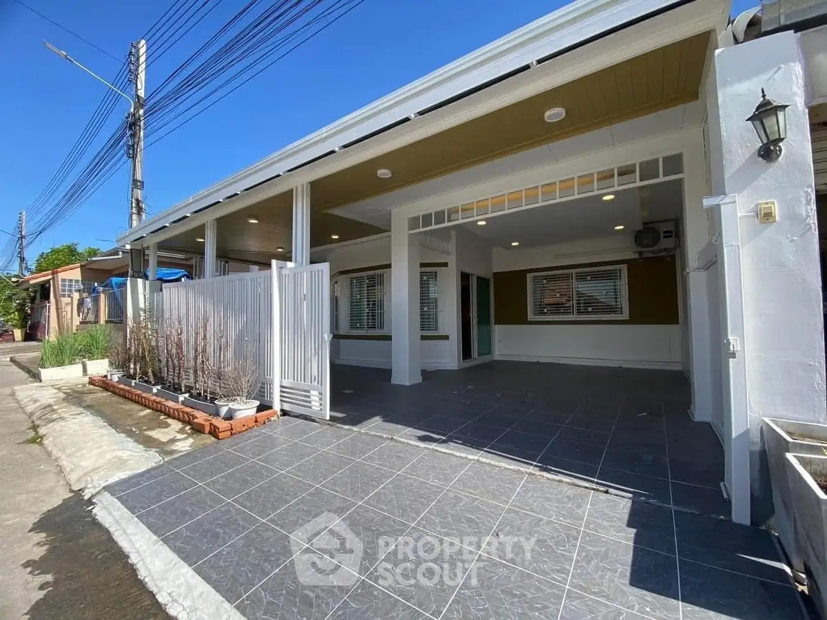 Spacious modern home exterior with covered parking and stylish design.