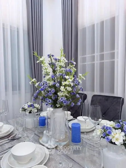 Elegant dining room setup with floral centerpiece and modern decor