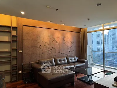 Spacious living room with modern leather sofa and city view