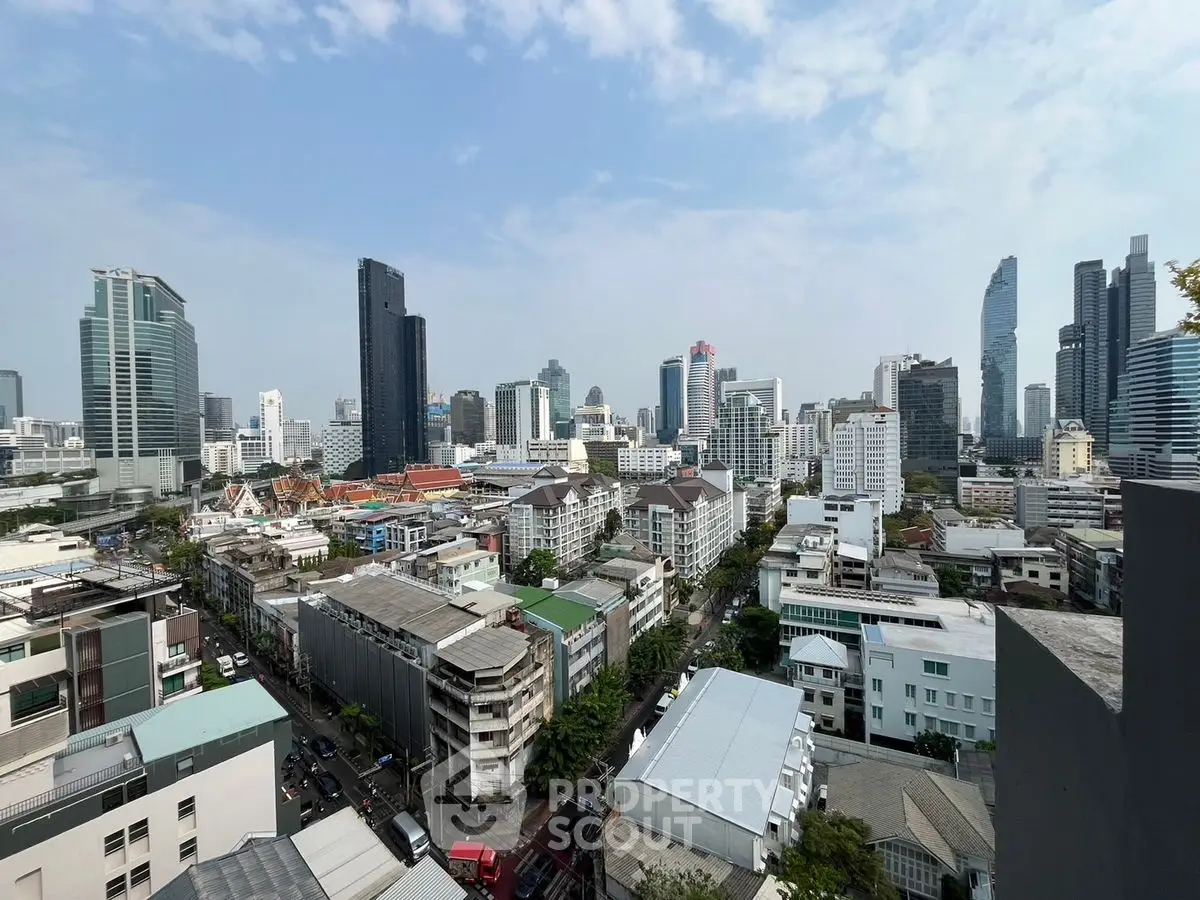 Stunning cityscape view showcasing modern skyscrapers and urban architecture under a clear blue sky.