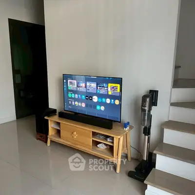 Modern living room with sleek TV setup and minimalist decor