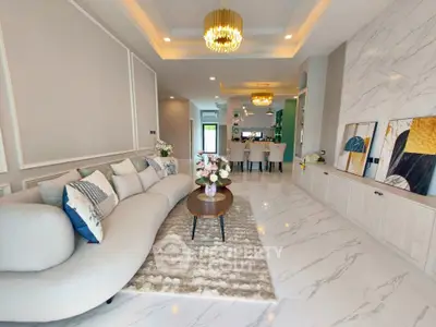 Luxurious living room with elegant decor and modern lighting in a stylish home.