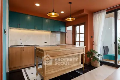 Stylish kitchen with wooden island and modern lighting in vibrant apartment