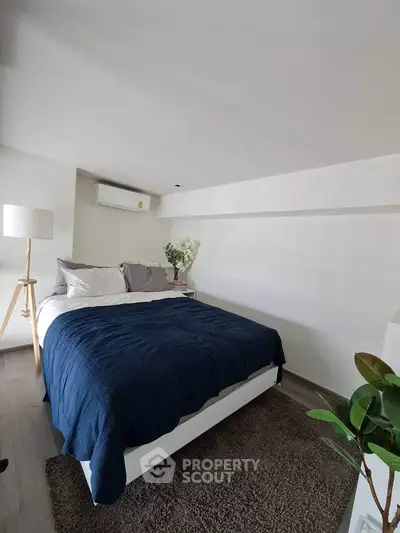 Modern bedroom with stylish decor and cozy atmosphere