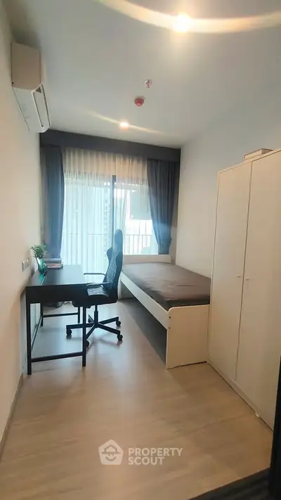 Modern minimalist bedroom with study desk and large window