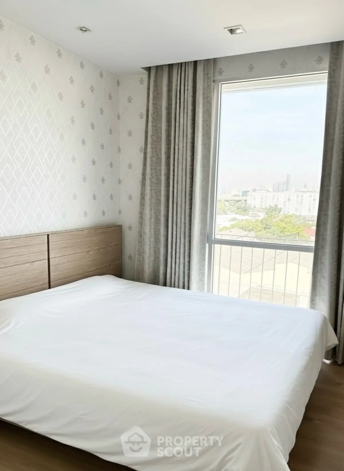 Bright and airy bedroom with large window and modern decor