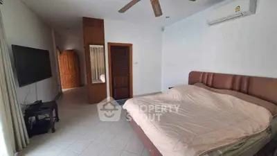 Spacious bedroom with modern amenities and natural light
