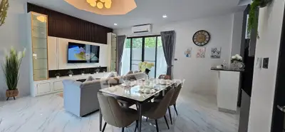 Modern open-plan living and dining area with stylish decor and natural light.