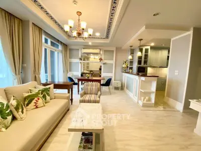 Elegant open-layout living room with modern kitchen and stylish decor