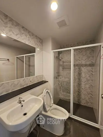 Modern bathroom with sleek shower and stylish tiles