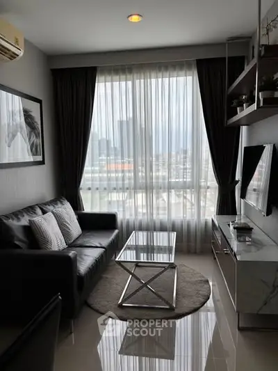 Modern living room with city view, sleek furniture, and natural light.