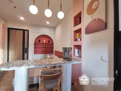 Stylish modern kitchen with terrazzo countertop and cozy seating area