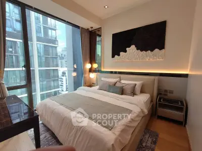 Luxurious modern bedroom with large windows and city view in high-rise apartment