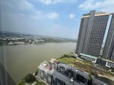 Stunning river view from high-rise apartment with modern architecture