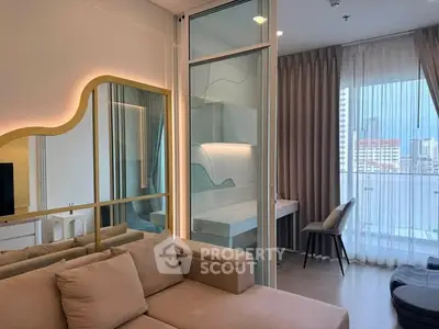 Modern living room with stylish decor and large windows offering city views.