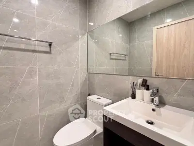 Modern bathroom with sleek design and elegant fixtures in a contemporary home.