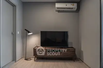 Modern living room with sleek TV stand and air conditioning unit