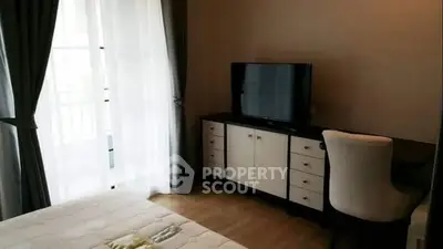 Cozy bedroom with natural light and modern furnishings