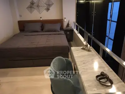 Modern bedroom with stylish decor and sleek furniture in a contemporary apartment.