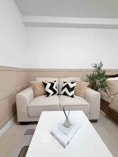 Cozy living room with stylish beige sofa and modern decor accents