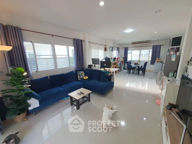 Spacious living room with modern decor and natural light