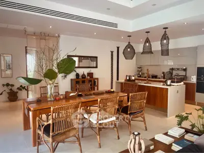 Stunning open-plan kitchen and dining area with modern decor and natural light.