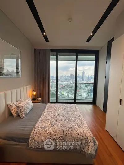 Luxurious bedroom with stunning city view from floor-to-ceiling windows