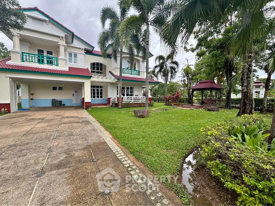 Stunning two-story house with lush garden and gazebo, perfect for family living.