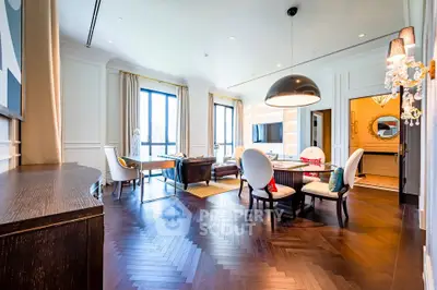 Luxurious living room with elegant decor and large windows in a modern apartment.