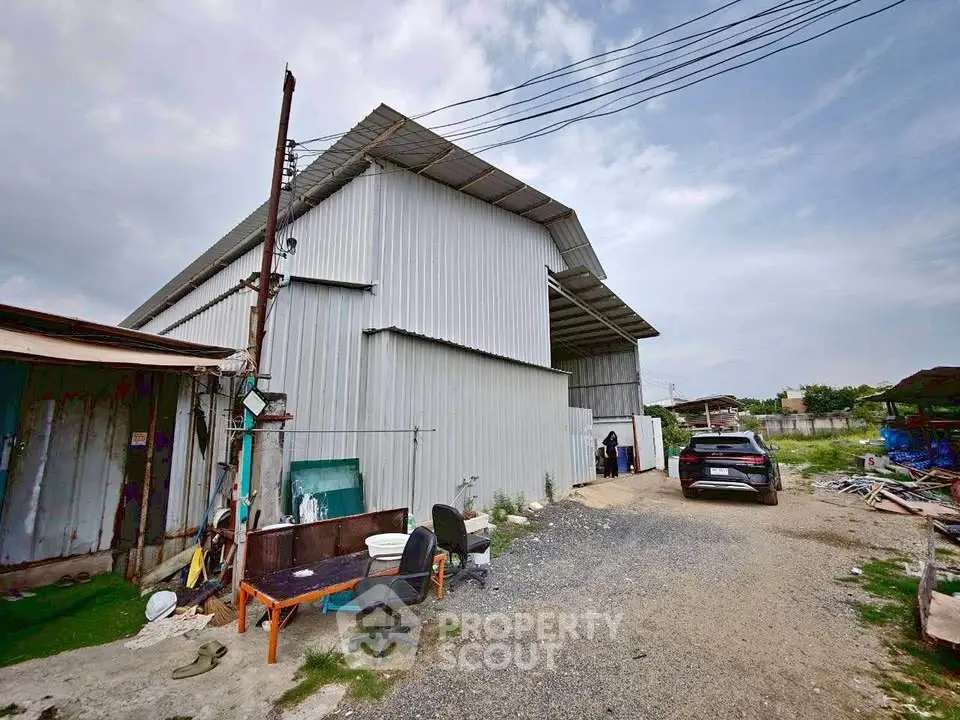 Spacious industrial warehouse with ample outdoor space and parking area.