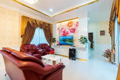 Luxurious living room with elegant decor and plush leather seating