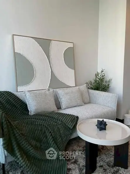 Stylish modern living room with elegant sofa and abstract art