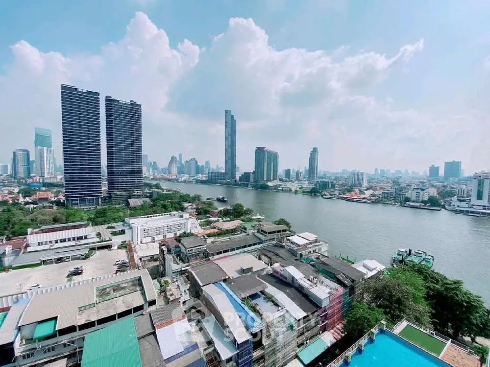 Stunning cityscape view with river and modern skyscrapers, perfect for urban living enthusiasts.