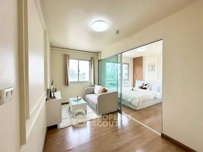 Bright and cozy apartment with sliding glass doors and modern decor