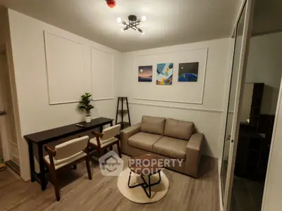 Modern living room with stylish decor, cozy sofa, and elegant lighting in a contemporary apartment.