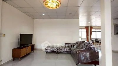 Spacious living room with modern furniture and natural light